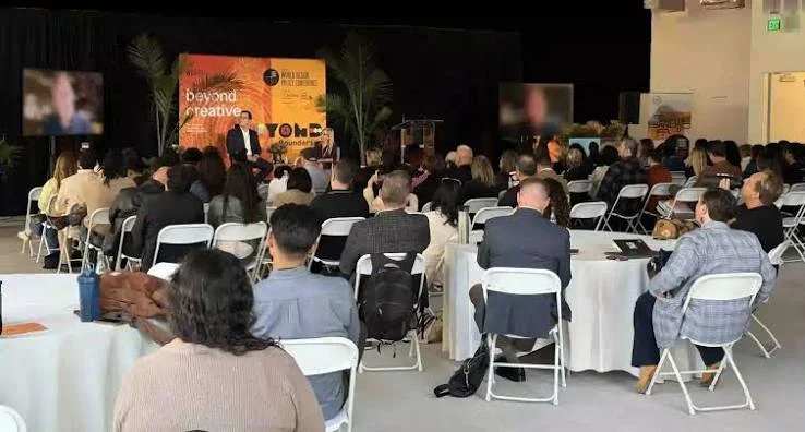 Installing WiFi in Dubai 25 Attendees seated at round tables watching a conference session with reliable event WiFi in Dubai